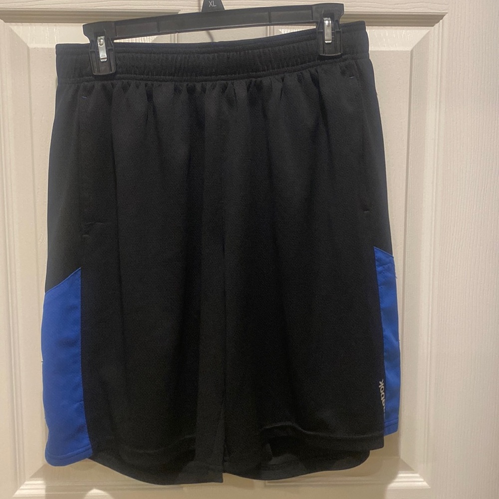 Men’s black with blue Reebok basketball shorts. Size medium